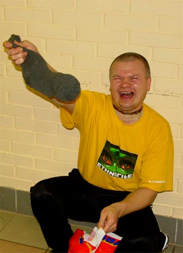Яшода Нандана прабху искренне радуется полученным подаркам (конфетам в носке)