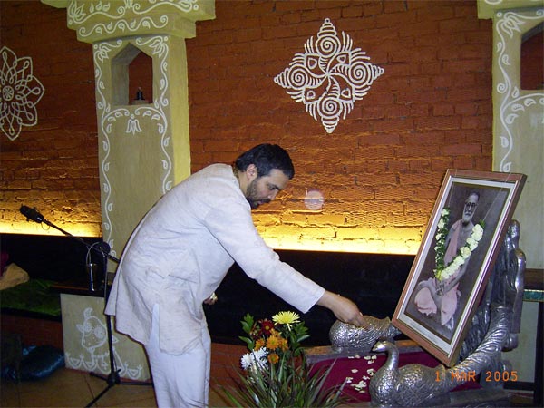 Madhav Krishna Prabhu is offering flower petals to Srila Saraswati Thakur